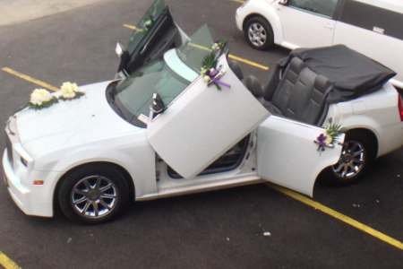 Decorated white Chrysler Wedding Car