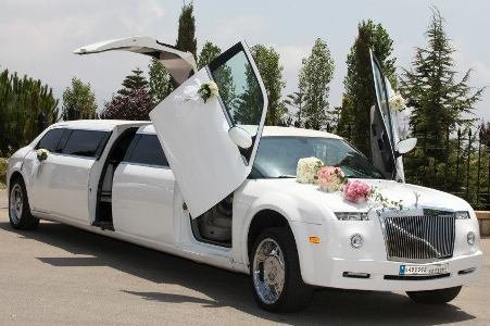 White Phantom Stretch Limousine with colorful wedding decoration