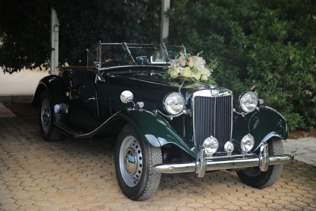 Dark green MG 1949 decorated with white roses