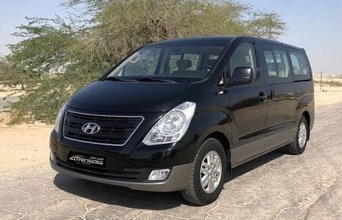 The front and side of a black van