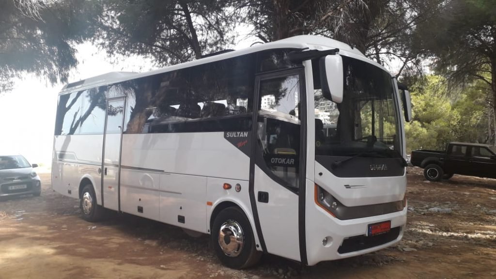 White medium sized bus for rental services