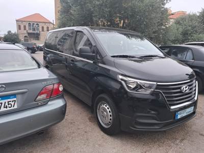 Luxury black H1 Mini Bus parked in Beirut parking lot