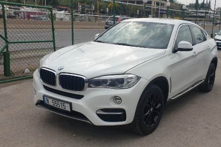 The front left side of the luxury BMW X6 with new tires