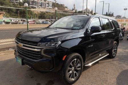 All black seven seater Chevrolet Tahoe next to Beirut Highway in Lebanon