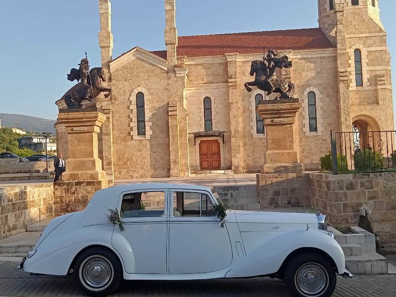 Vintage wedding Rolls Royce in front of church in Beirut Lebanon