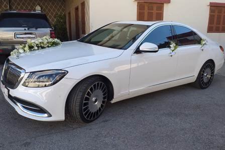 White Luxury Maybach wedding car in front of a house in Beirut Lebanon