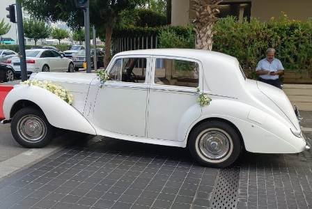 The side of the vintage rolls royce parked next to stone pavement in Beirut Lebanon