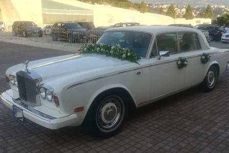White Rolls Royce Silver Shadow with white flower decoration