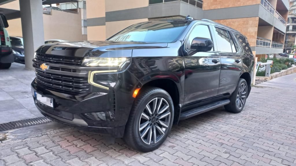Luxury Tahoe 2023 black parked under a luxurious building in Beirut Lebanon