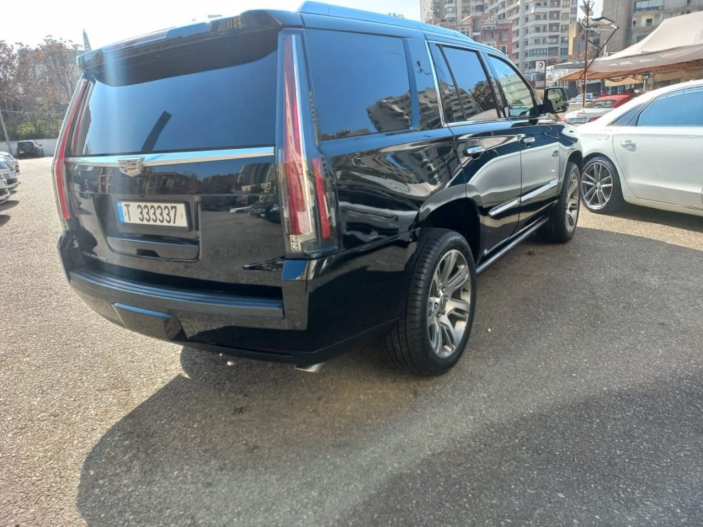The back side of the black Cadillac Escalade black 